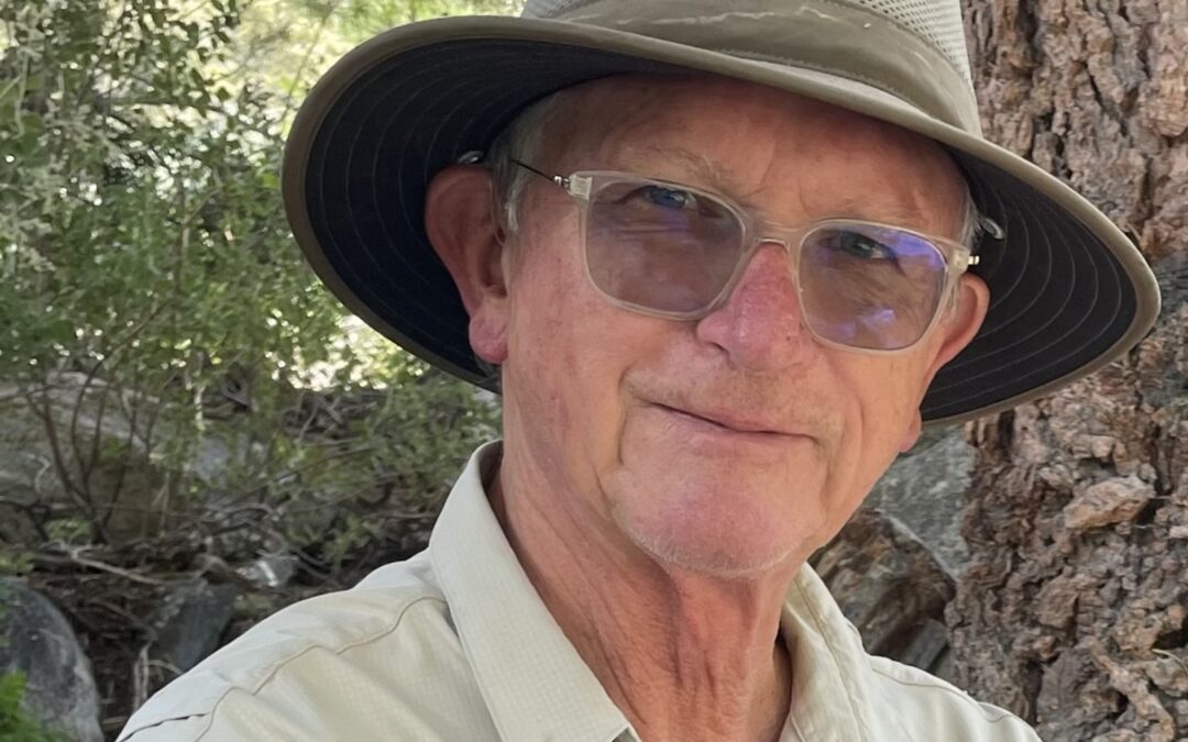 bill dyer wearing hat and sunglasses outside