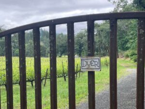 gate to vineyard with dyer sign